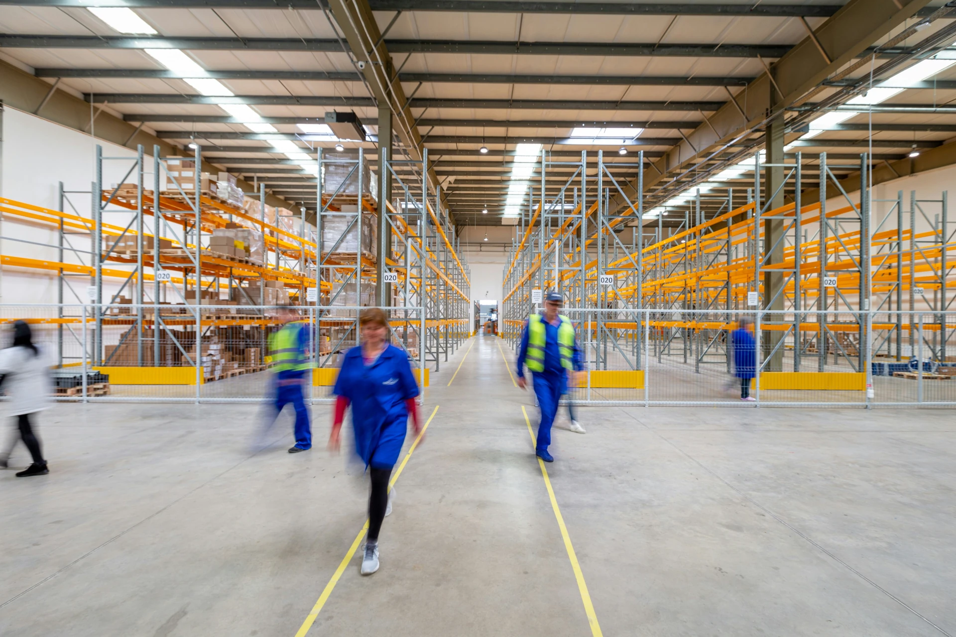 people walking around a warehouse