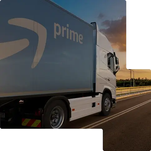 White and blue HGV with Prime logo driving on a motorway