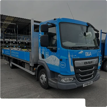 A blue truck parked in a car park