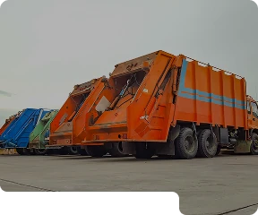 A line of bin trucks parked in a car park