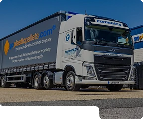 The front of a HGV truck parked in a car park.